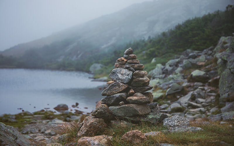 The stacking of rocks into cairns can damage fragile alpine ecosystems and lead hikers astray. 