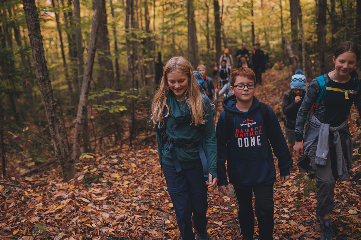 children hiking through Cardigan Reservation, NH